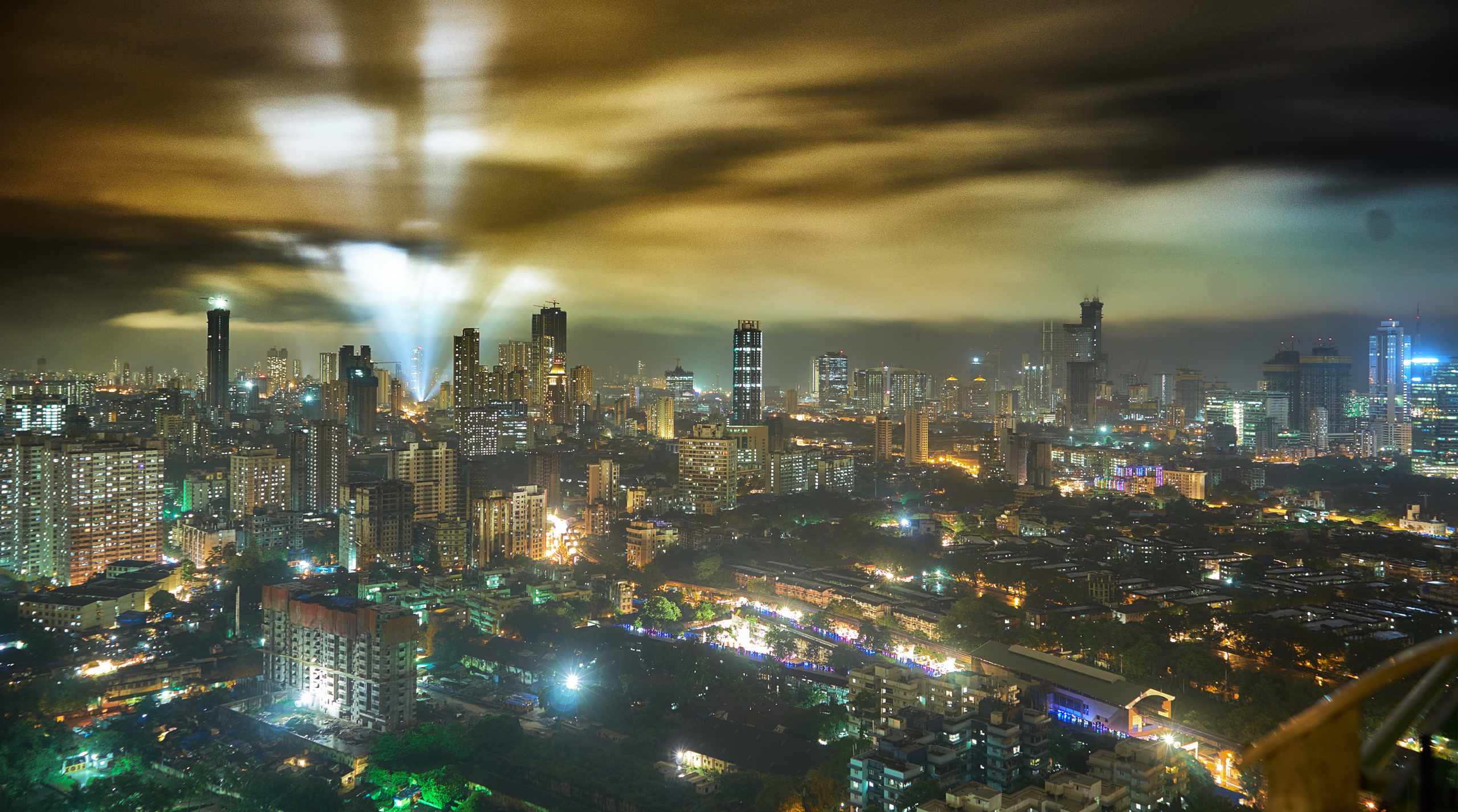 Dense Mumbai high-rises at night with festival light beams. India, Offshore BPO Confidence Index 2023