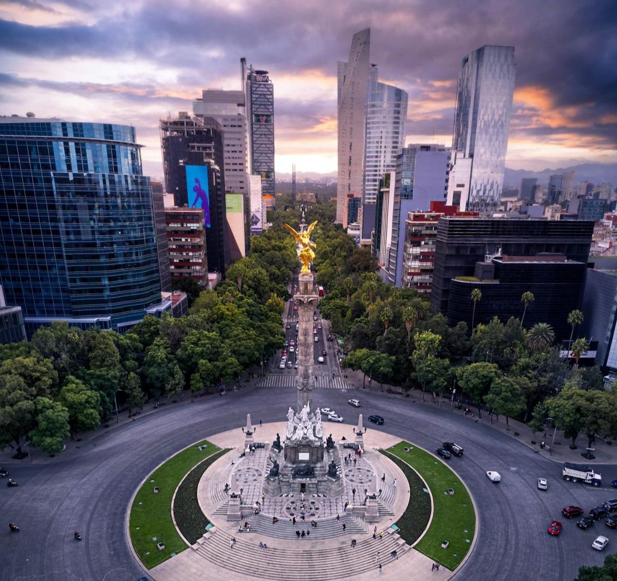 Aerial view of the Angel of Independence monument in Mexico City at sunset, surrounded by office towers. Mexico, Offshore BPO Confidence Index 2024